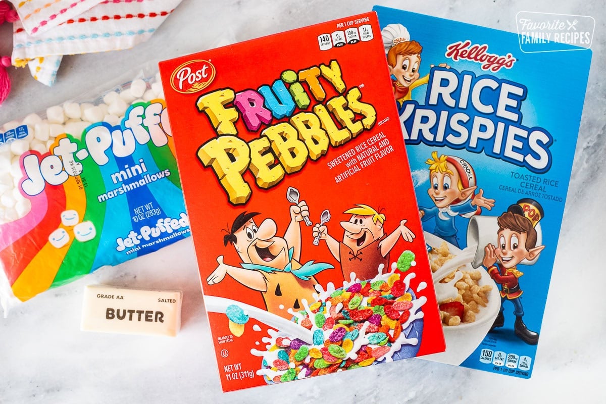Ingredients to make fruity pebbles rice crispy treats including fruity pebbles, rice crispies, mini marshmallows and butter.
