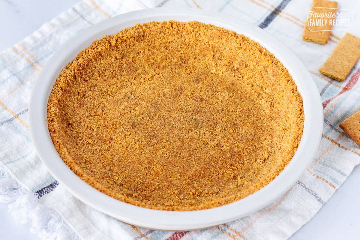 Full Graham Cracker Pie Crust pressed into a pie plate.