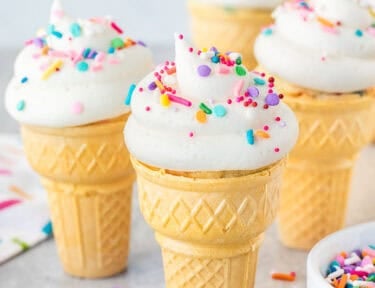 Frosted and sprinkled Ice Cream Cone Cupcakes.