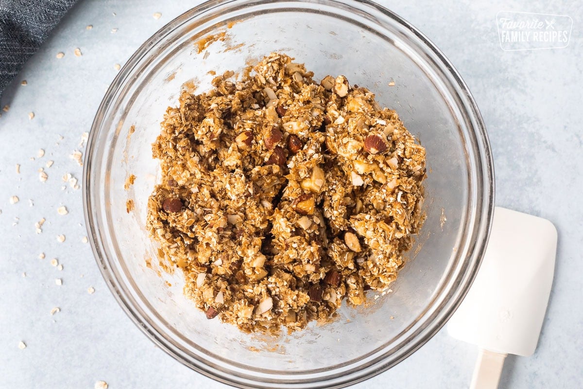 Glass bowl with peanut butter granola bar mixture.