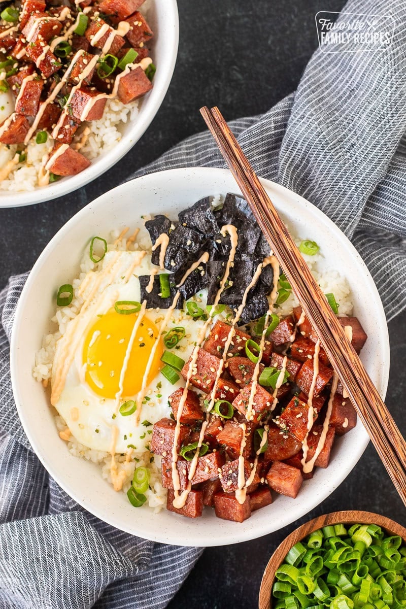Spam Musubi Bowls with spam, egg, green onion, nori and rice. Topped with spicy mayo.