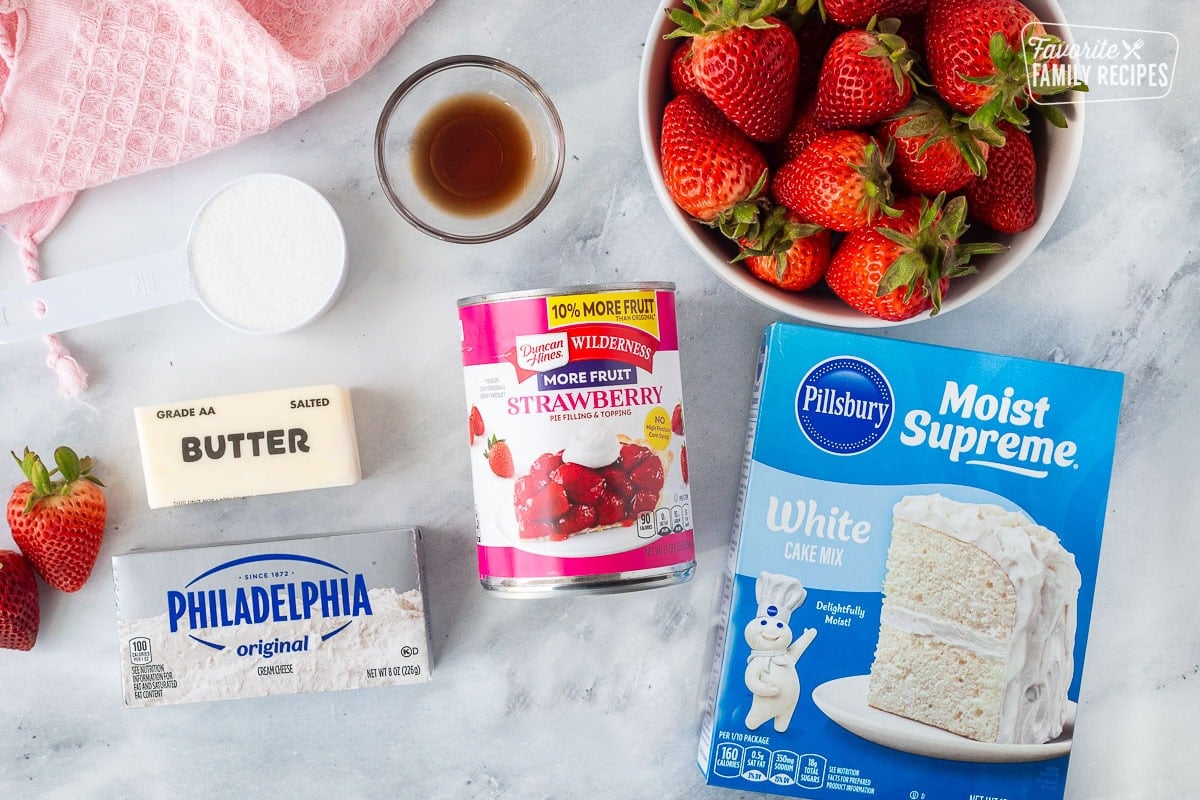 Ingredients to make Strawberry Cheesecake Dump Cake including vanilla cake mix, strawberries, vanilla, strawberry pie filling, sugar, butter, cream cheese.