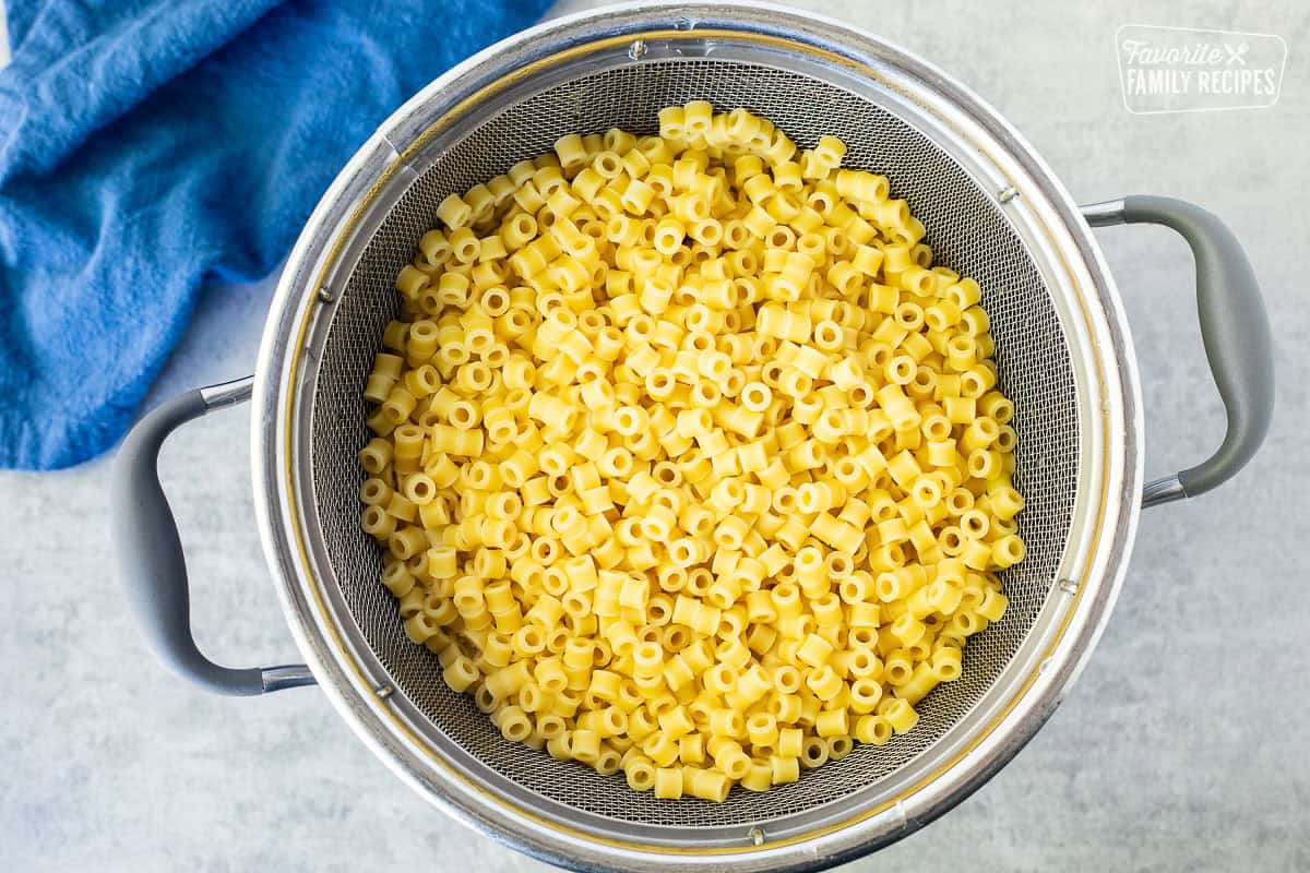 Cooked pasta in a colander.