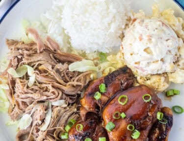 Hawaiian Plate Lunch with teriyaki chicken, kalua pork, white rice and Mac salad.