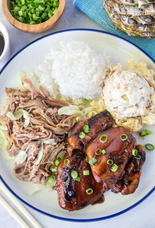 Hawaiian Plate Lunch with teriyaki chicken, kalua pork, white rice and Mac salad.