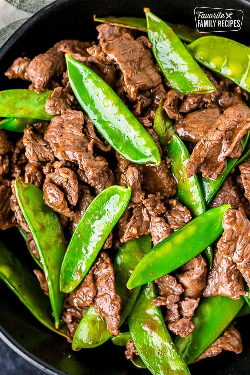 Bowl of beef and snow peas.