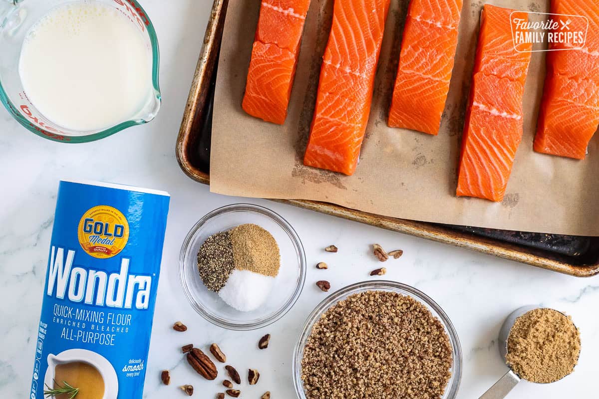 Ingredients to make Pecan Salmon including salmon, milk, wonder, spices, crushed pecans and brown sugar.