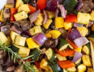 Roasted vegetables in a casserole dish.