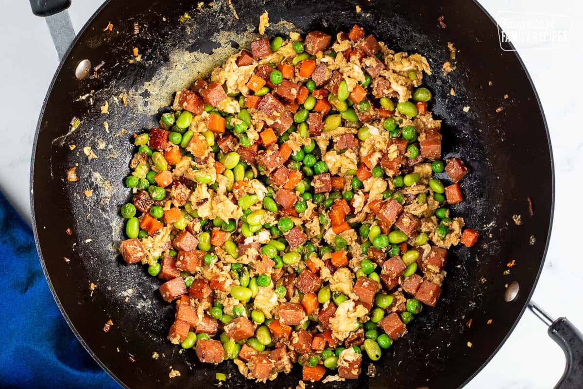 Wok with cooked vegetables, spam and scrambled eggs.