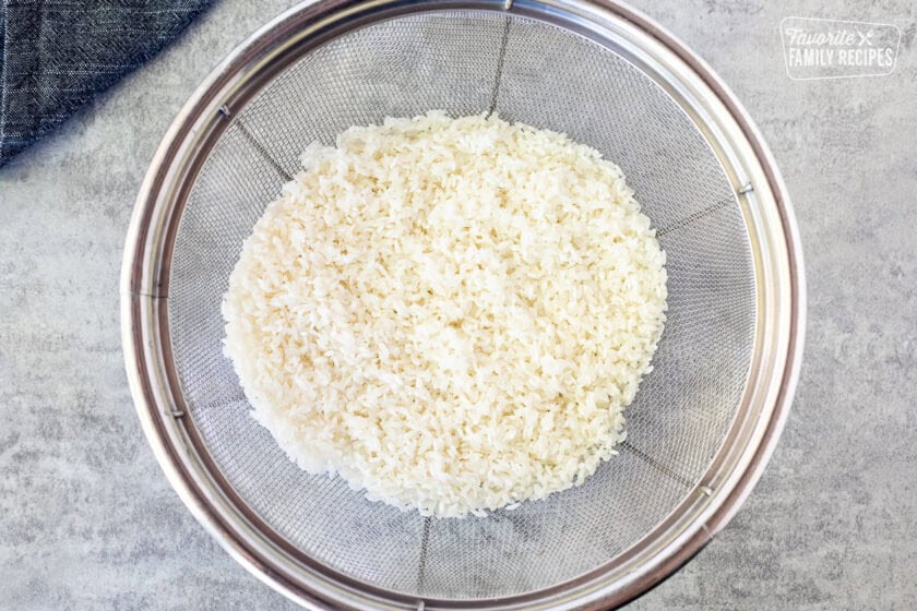 Colander with drained sushi rice.