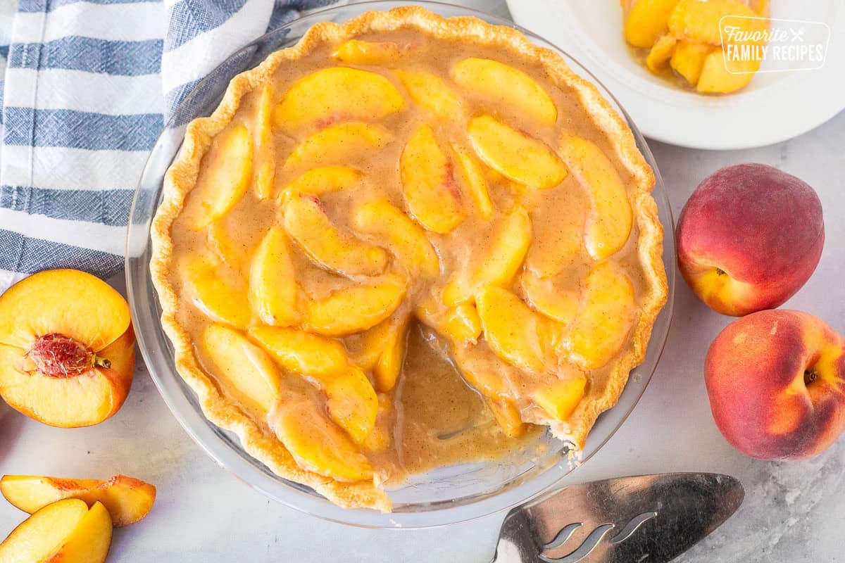 Peach Pie with a slice missing.