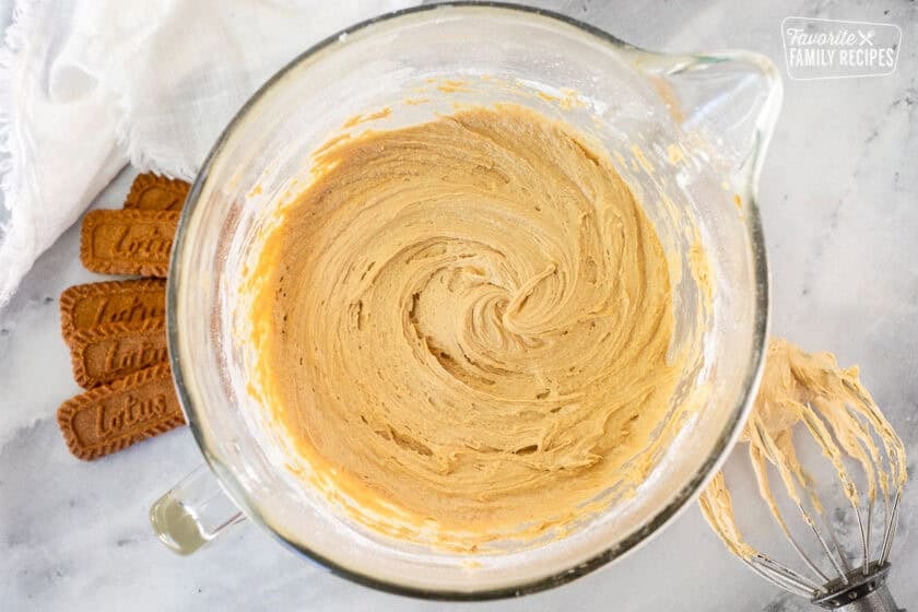 Mixing bowl with Biscoff cinnamon roll frosting with whisk attachment.