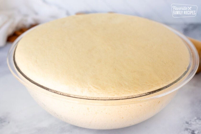 Dough risen in bowl.