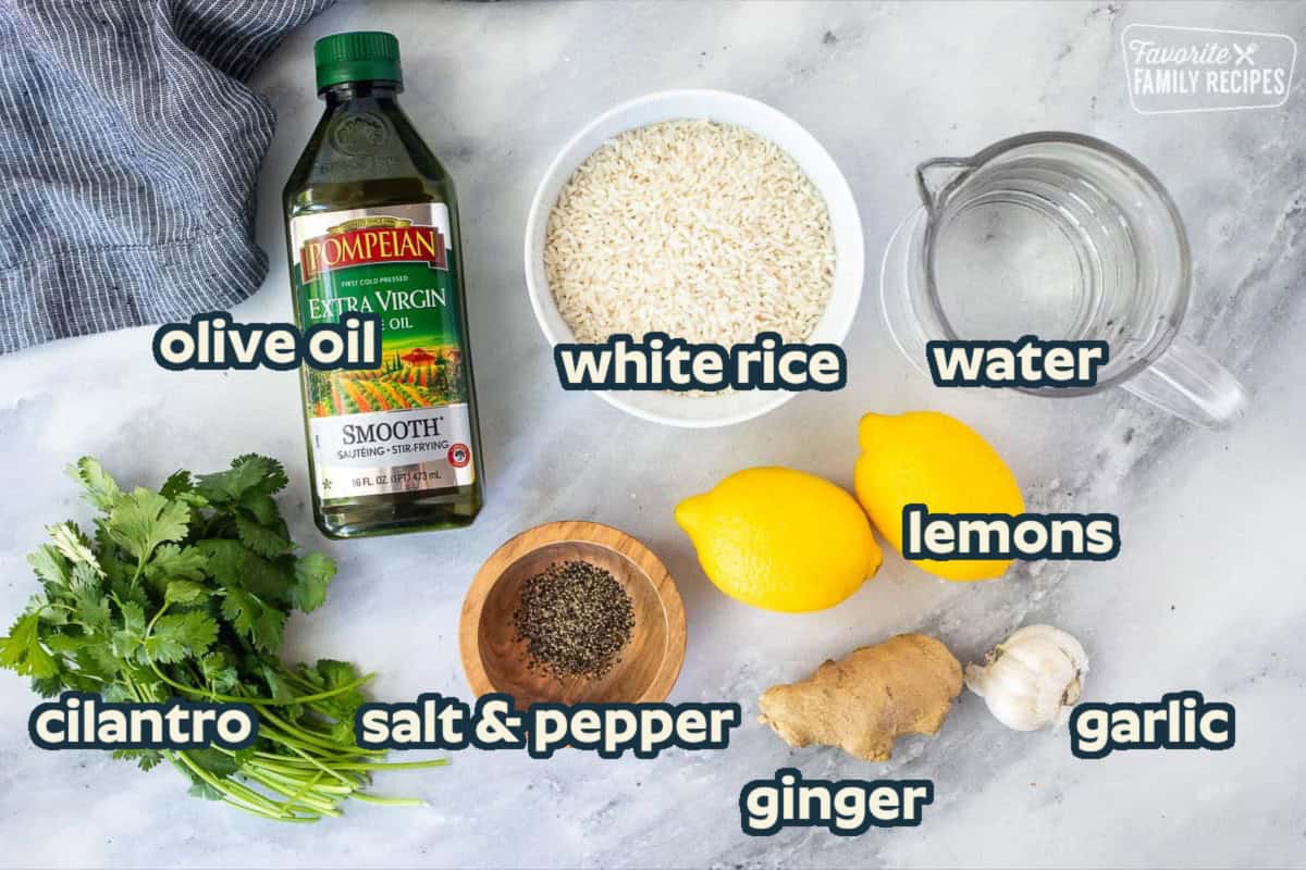 Ingredients to make easy lemon rice including rice, lemons, water, ginger, garlic, olive oil, pepper and cilantro.