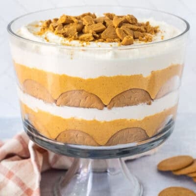 Pumpkin trifle layered with ginger snap cookies, pumpkin cream cheese layer and whipped cream.