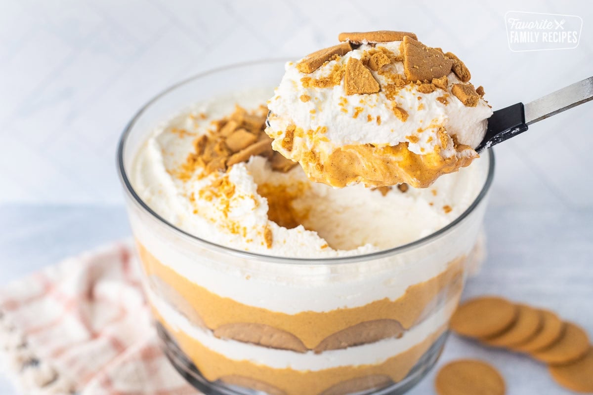 Scoop out of a pumpkin trifle dish with cream cheese pumpkin, whipped cream and crushed ginger snap cookies.