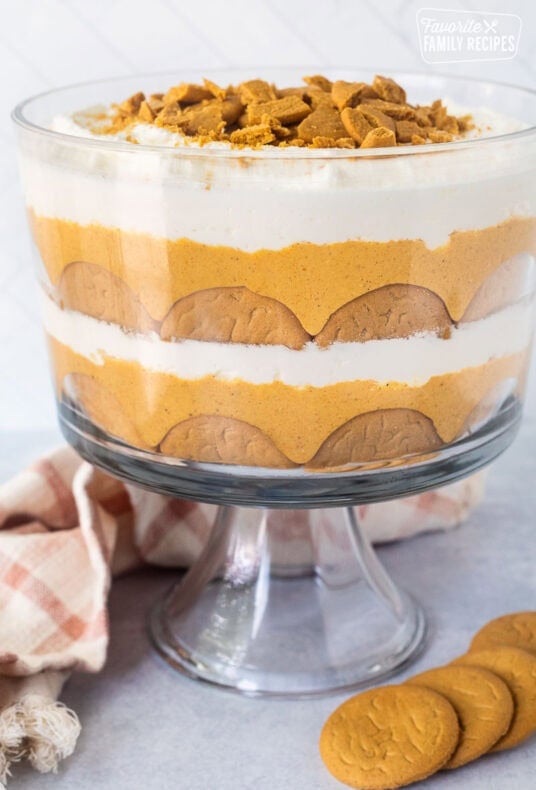 Pumpkin trifle layered with ginger snap cookies, pumpkin cream cheese layer and whipped cream.