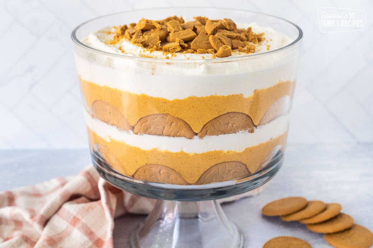 Pumpkin trifle layered with ginger snap cookies, pumpkin cream cheese layer and whipped cream.