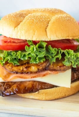 Teriyaki Chicken Sandwich with teriyaki chicken, pepper jack cheese, ham, grilled pineapple, lettuce an tomato.