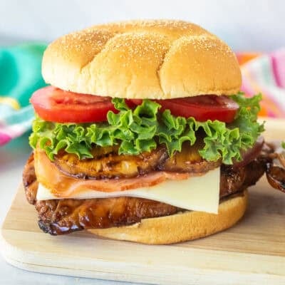 Teriyaki Chicken Sandwich with teriyaki chicken, pepper jack cheese, ham, grilled pineapple, lettuce an tomato.