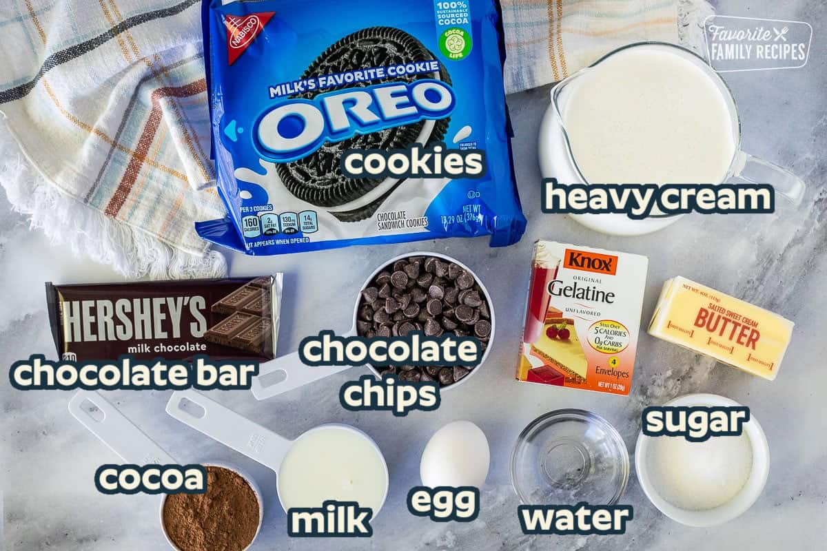 Ingredients to make Chocolate Satin Pie including Oreo cookies, heavy cream, milk, butter, Gelatin, sugar, water, egg, cocoa powder, chocolate chips and chocolate bar.