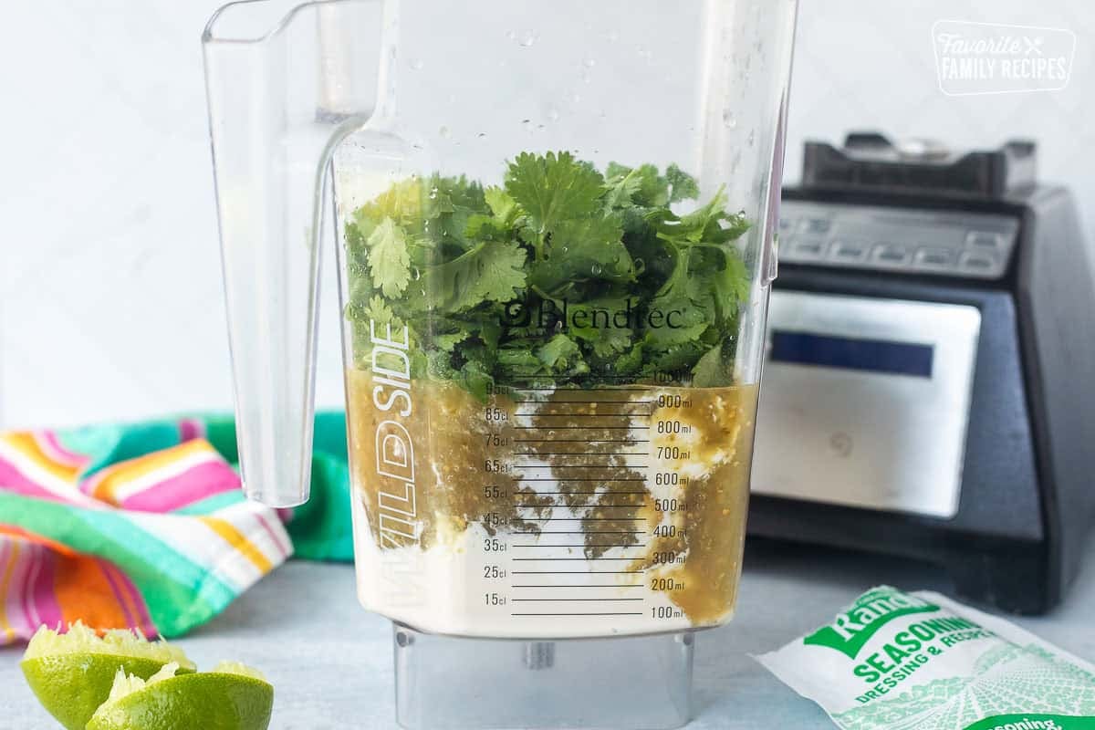 Blendtec blender with ingredients to make Cilantro Lime Sauce.
