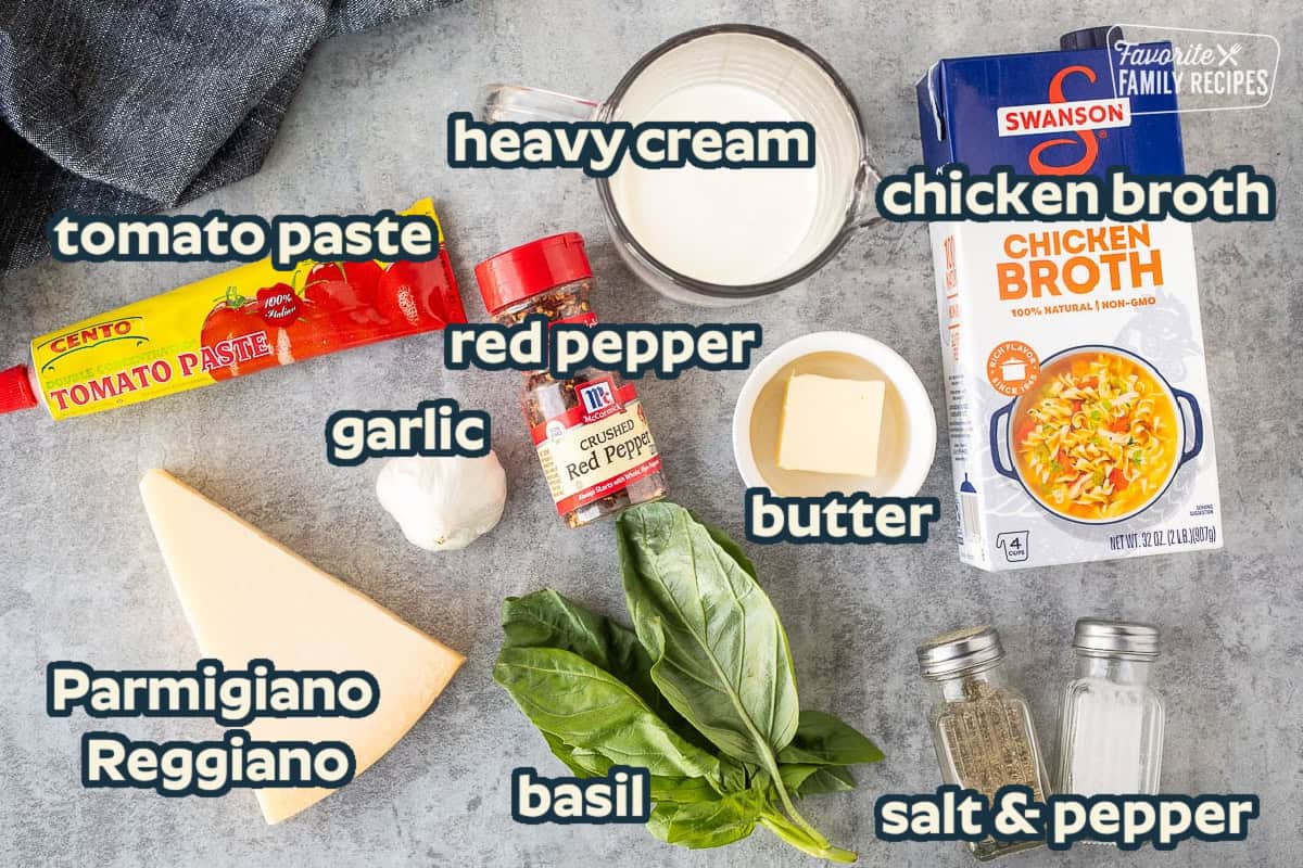 Ingredients to make ravioli sauce including chicken broth, heavy cream, butter, basil, crushed red pepper, garlic, cheese, tomato paste, salt and pepper.