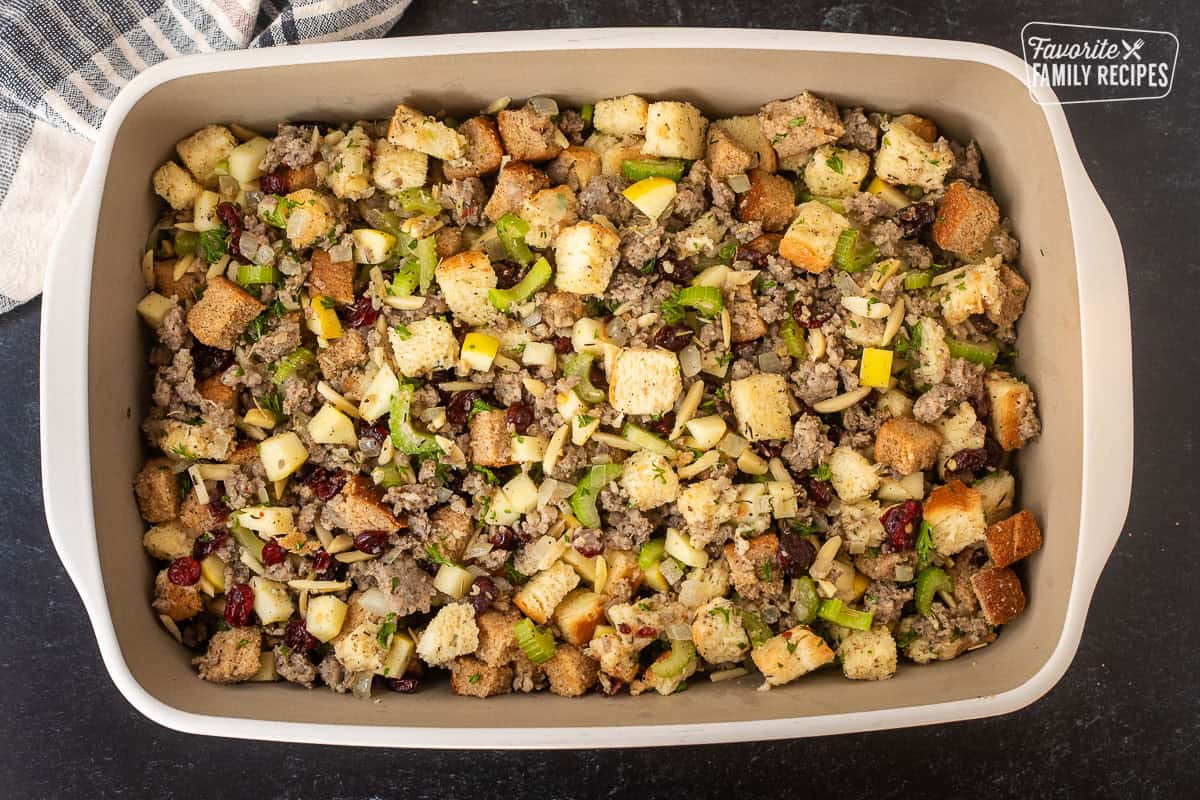 Glass baking dish with sausage stuffing mixture.