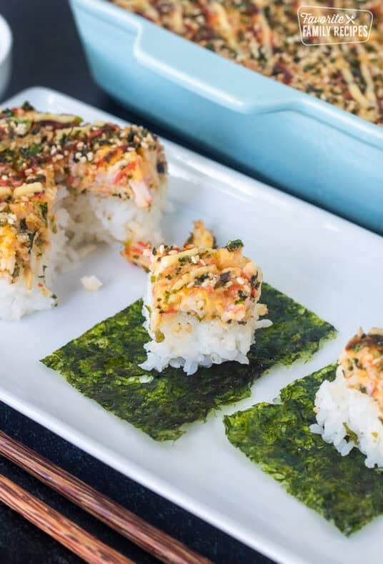 Pieces of sushi bake on top of nori.