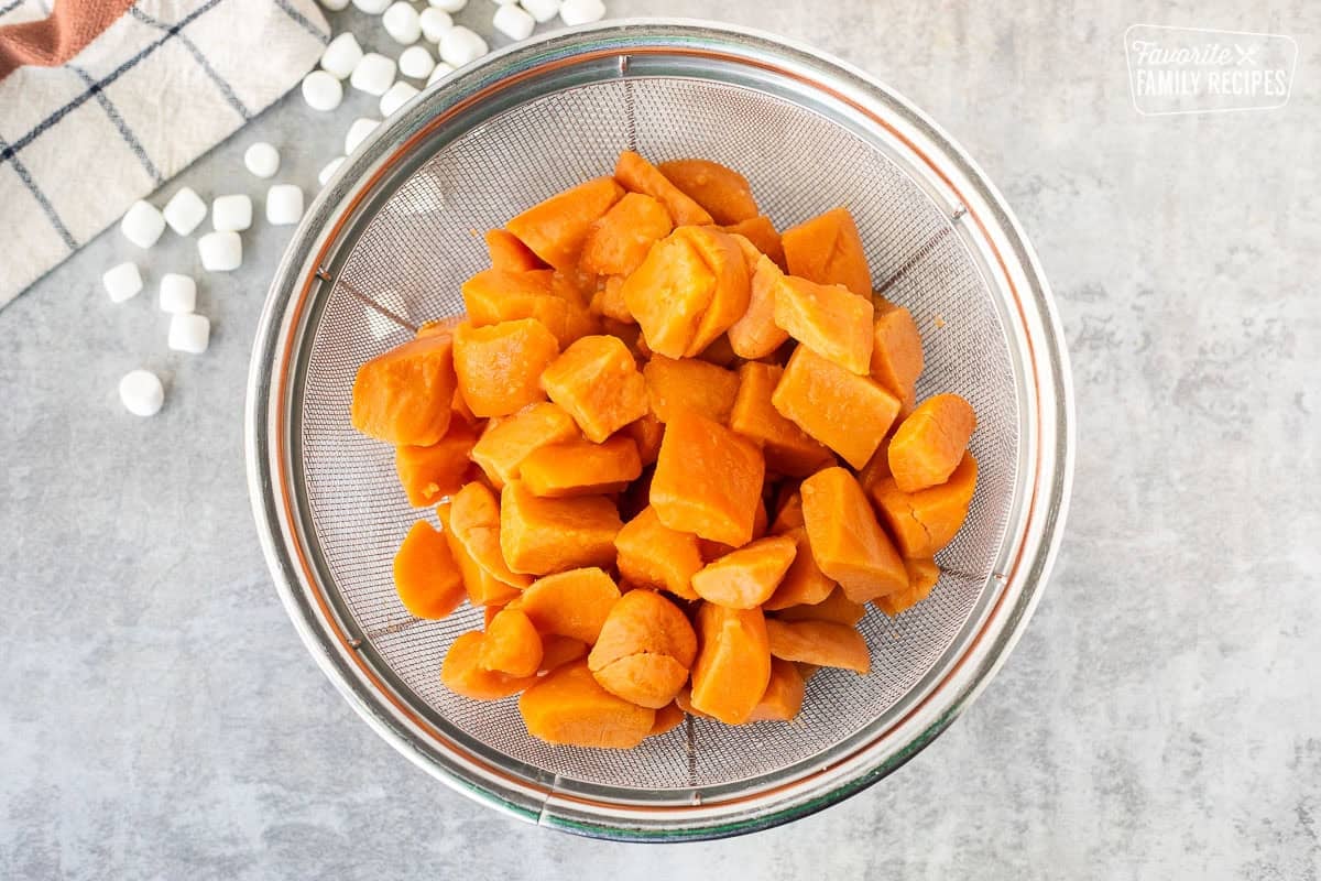 Colander with drained sweet potatoes.