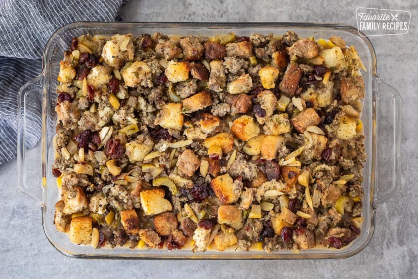 Stuffing on top layer of Thanksgiving Leftover Casserole in glass dish.
