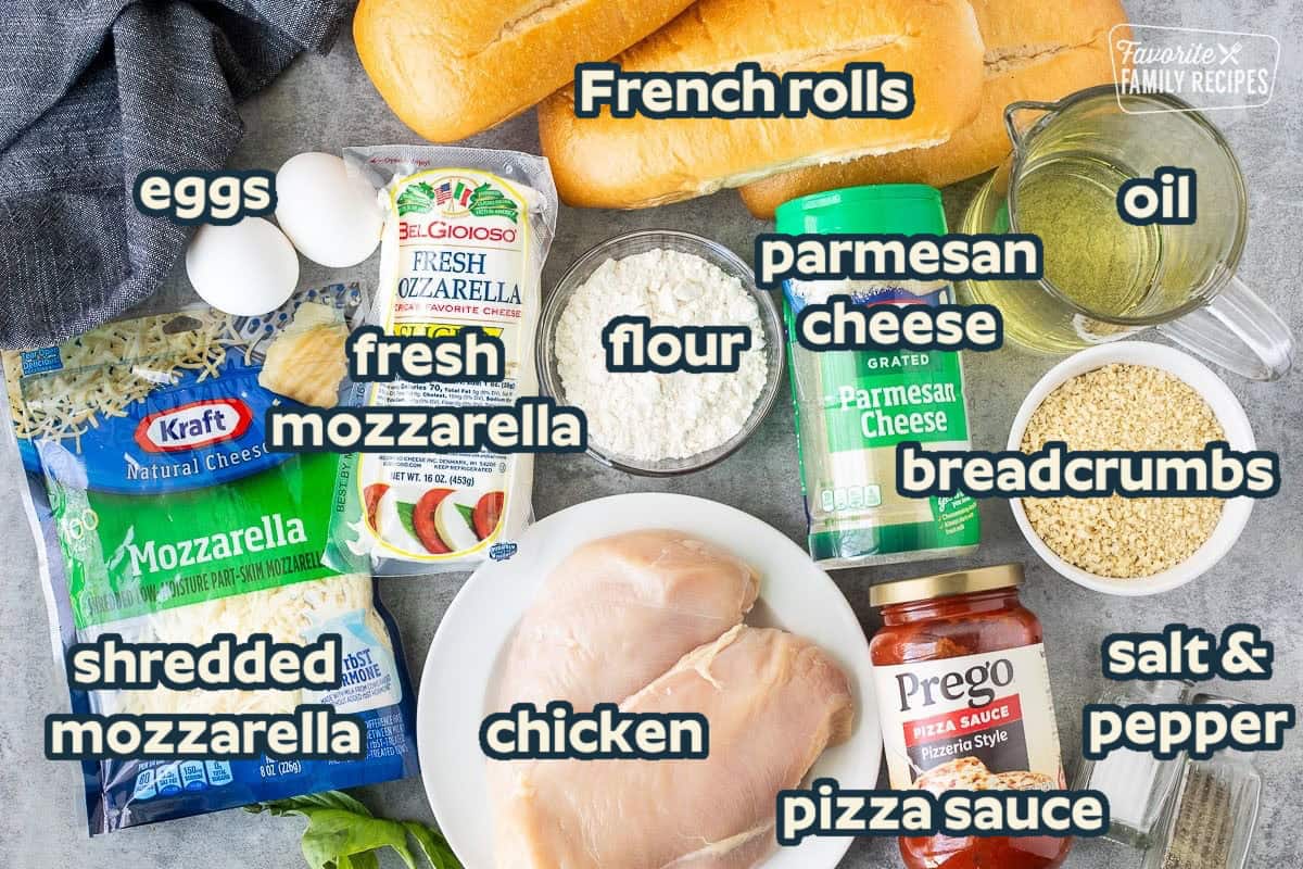 Ingredients to make Chicken Parmesan Sandwich including fresh mozzarella, shredded mozzarella, chicken breast, marinara sauce, Panko breadcrumbs, salt, pepper, oil, Parmesan cheese, flour and bread rolls.