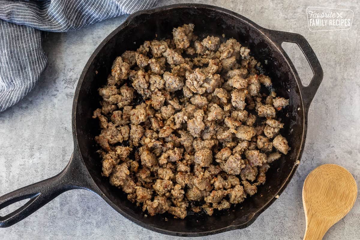 Skillet with cooked sausage to make biscuits and gravy.