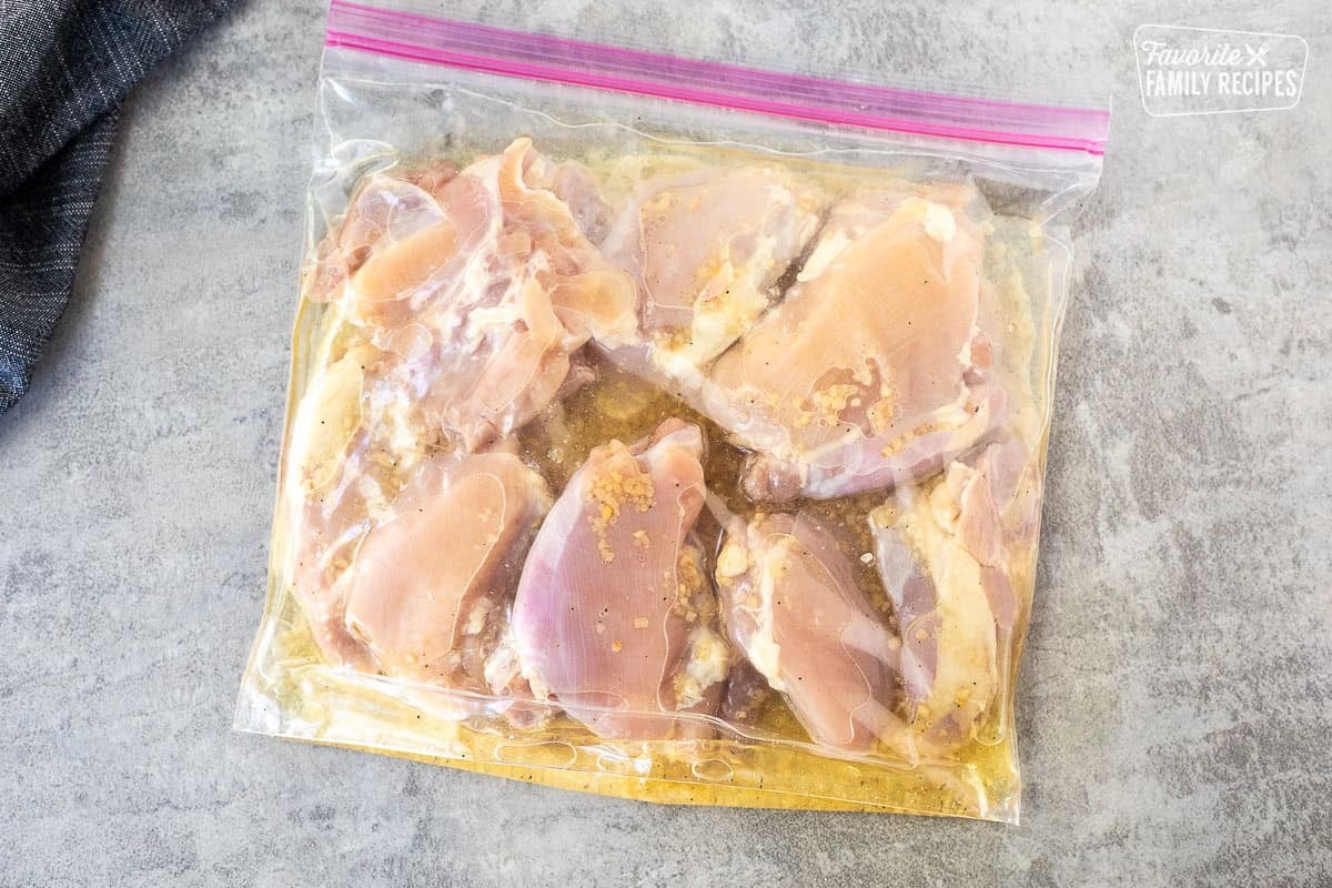 Ziplock bag with chicken thighs in marinade.