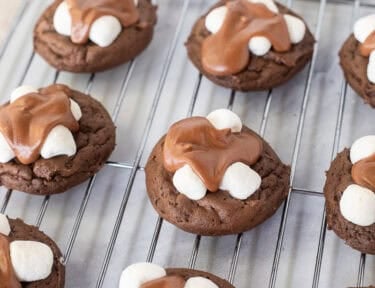 Frosted Chocolate marshmallow cookies on a cooling rack.