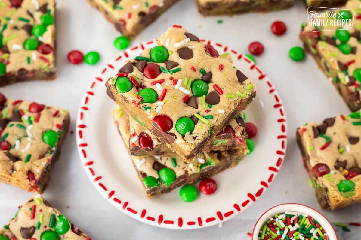 Christmas Cookie Bars stacked on a plate.