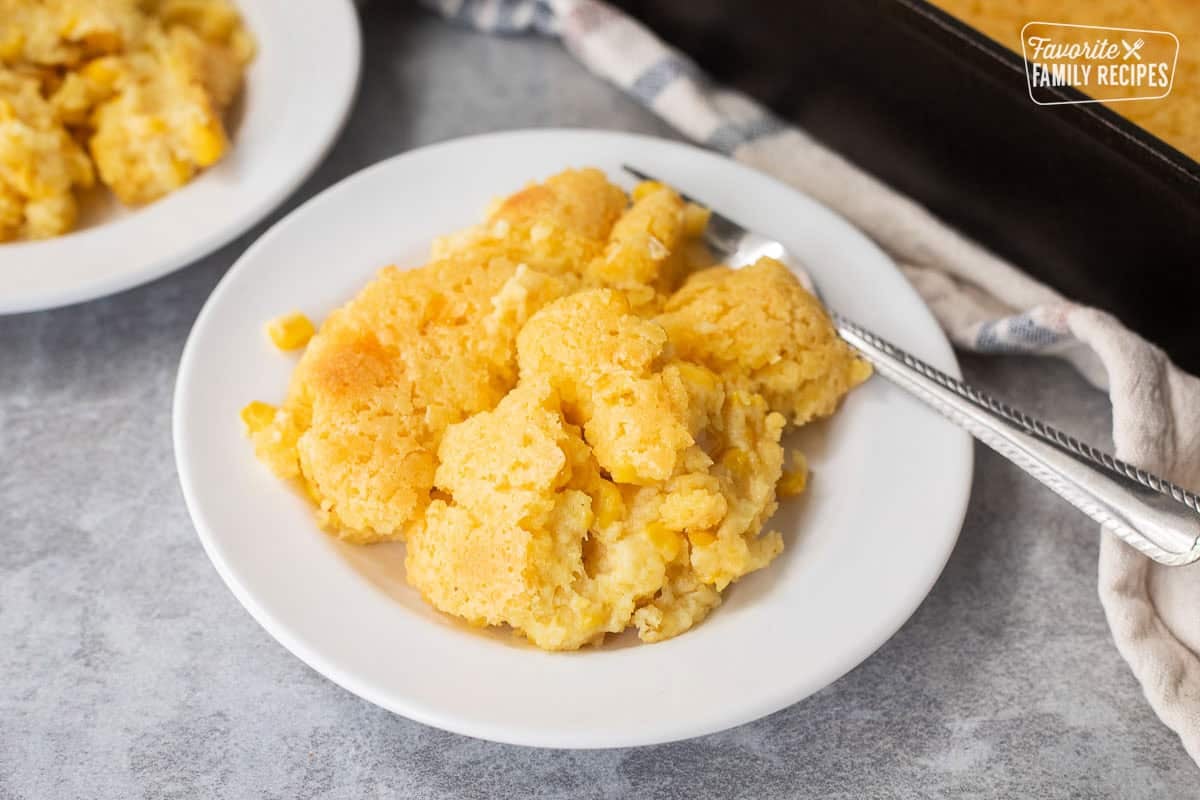 Plate with cornbread pudding and fork.