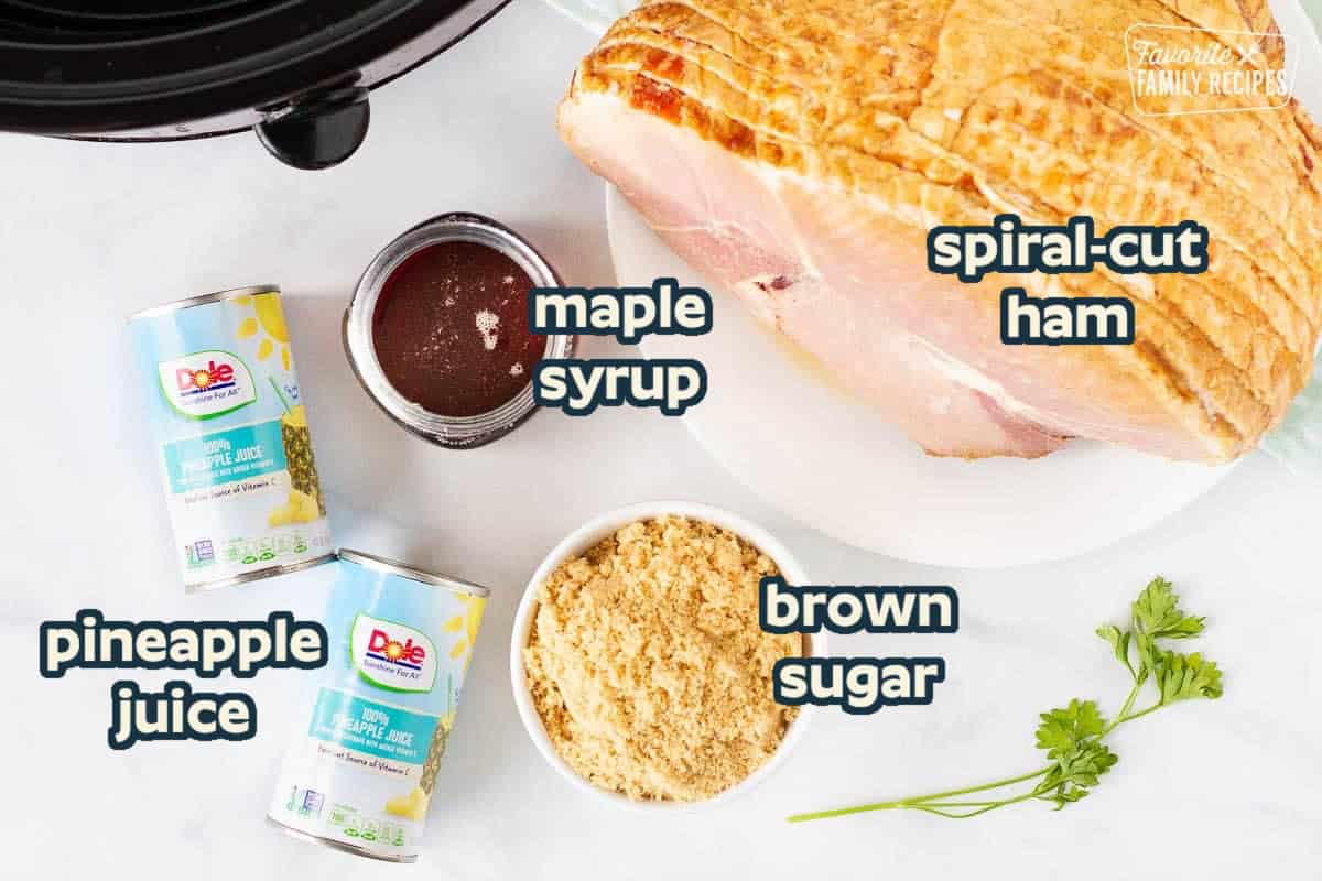 Ingredients needed for a crockpot spiral ham recipe: spiral-cut ham, maple syrup, brown sugar, pineapple juice