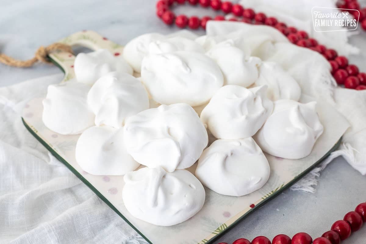 Stacked divinity candy on a platter lined with parchment paper.