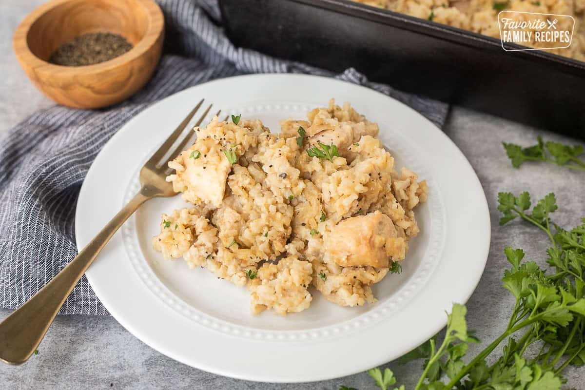 Easy Chicken Casserole lives up to its name; easy to make, easy to eat and easy to clean up! Perfect dinner for busy weeknights when nothing but "easy" will do. Easy chicken casserole on a plate with parsley.