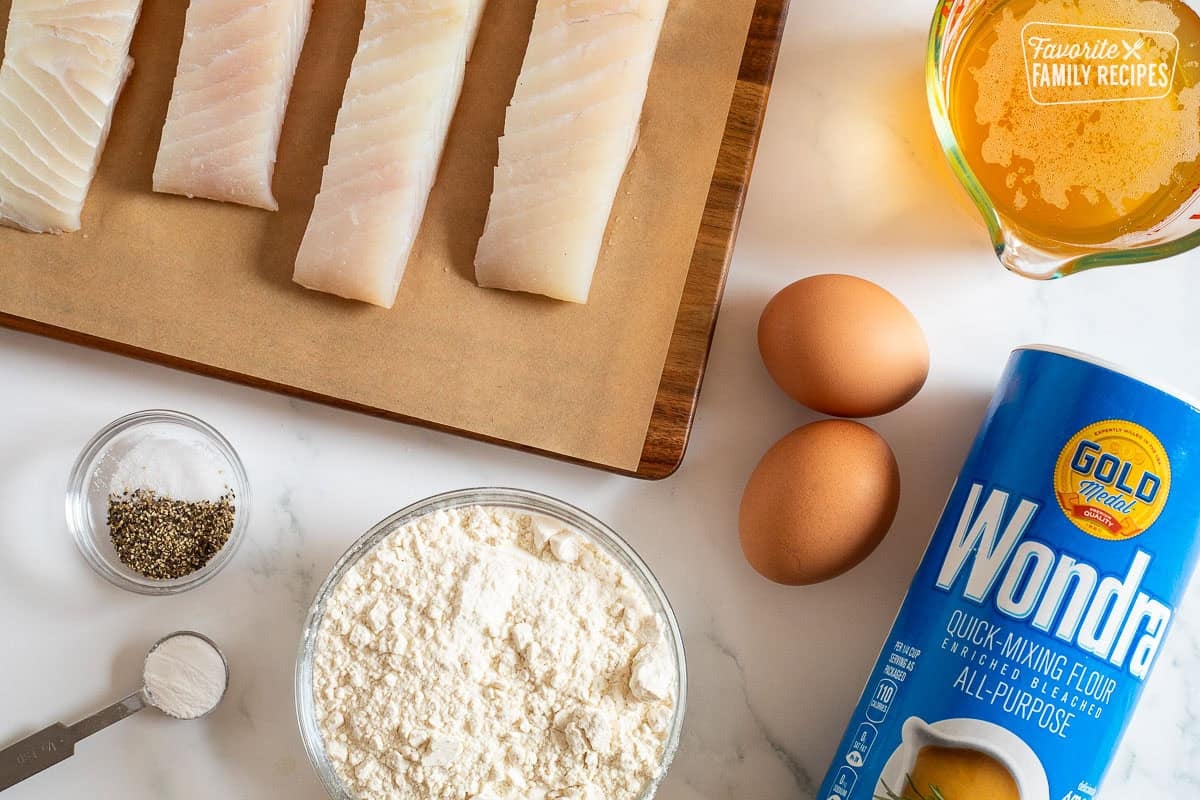 Ingredients to make Halibut Tacos including halibut, oil, eggs, Wondra flour, flour, baking powder, salt and pepper.