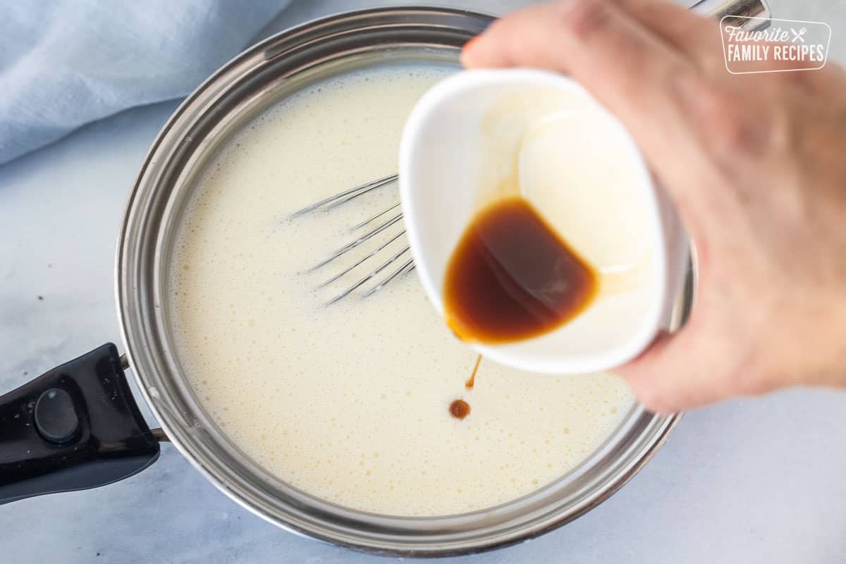 Pour vanilla into saucepan of Panna Cotta mixture.