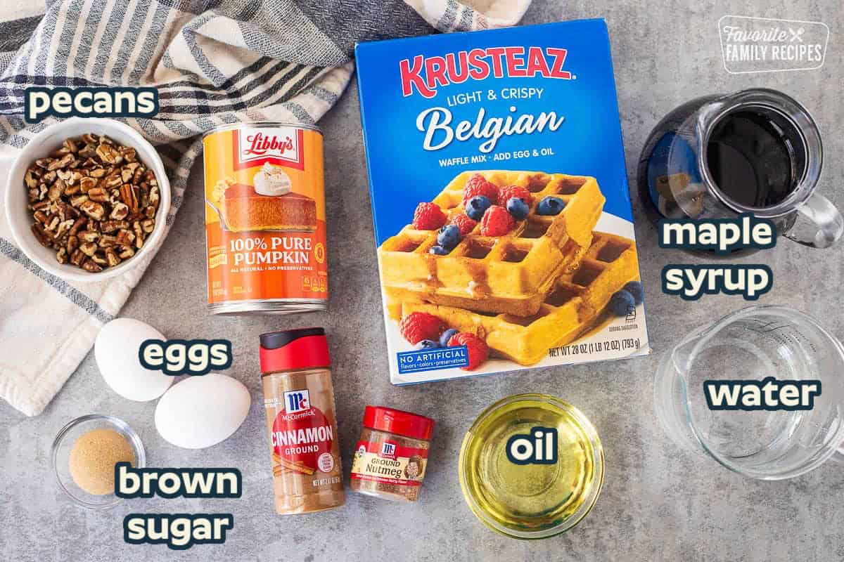 Ingredients to make pumpkin waffles: Belgian waffle mix, eggs, oil, pumpkin, cinnamon, nutmeg, maple syrup