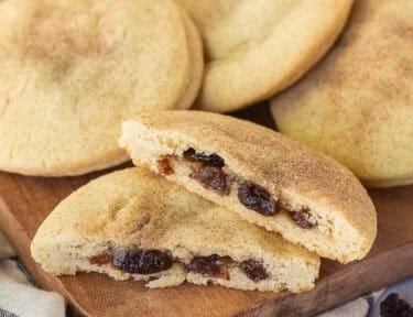 Raisin Filled Cookie cut in half next to other cookies.