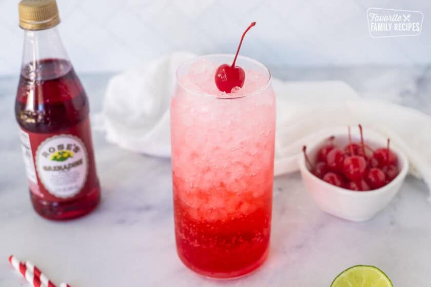 Maraschino cherry on top of Shirley Temple Drink.