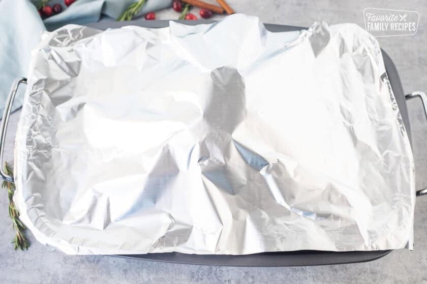 Roasting pan covered with foil.