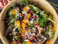 Christmas salad with spring mix, feta, candied pecans, pomegranate, mandarin oranges, dried cranberries and poppyseed dressing.