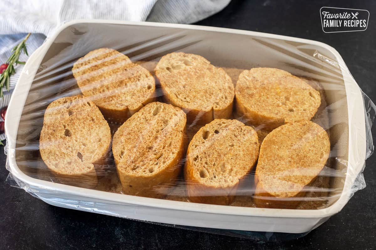Covered baking dish of eggnog French toast.