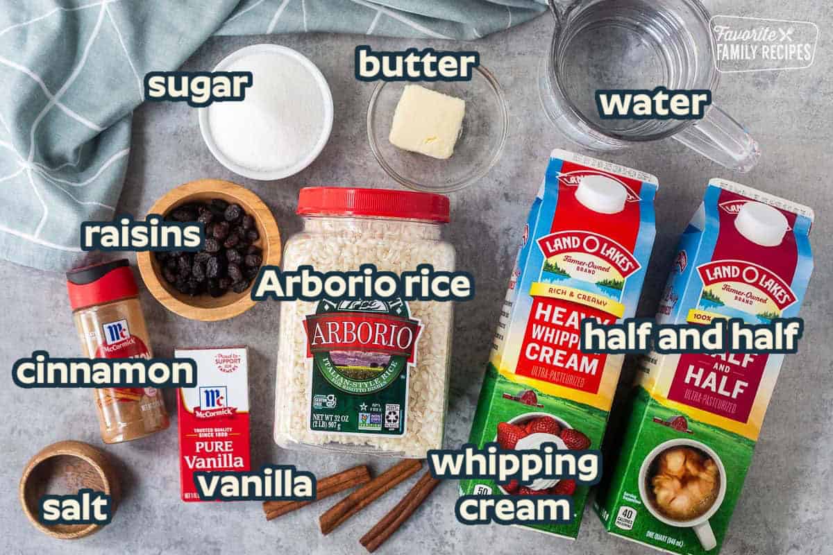 Ingredients to make instant pot rice pudding including water, heavy whipping cream, half-and-half, butter, rice, raisins, sugar, salt, cinnamon and vanilla.