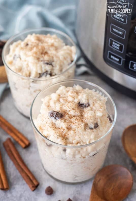 Instant pot roast pudding served in two glasses. Cinnamon sprinkled on top.